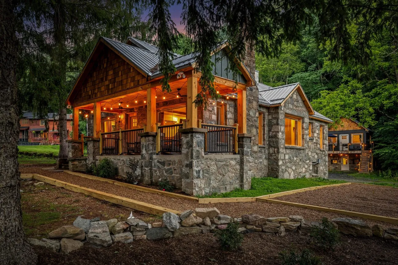 The Banner Elk Collection — stone lodge at twilight